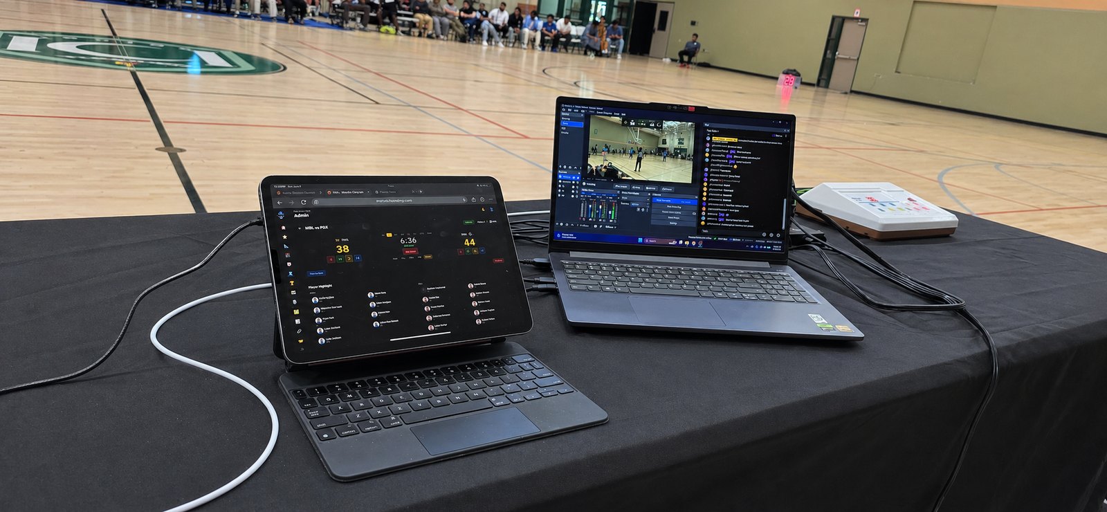 ScoreLM tablet scorebug control and broadcast laptop set up courtside at the MCL 2026 tournament